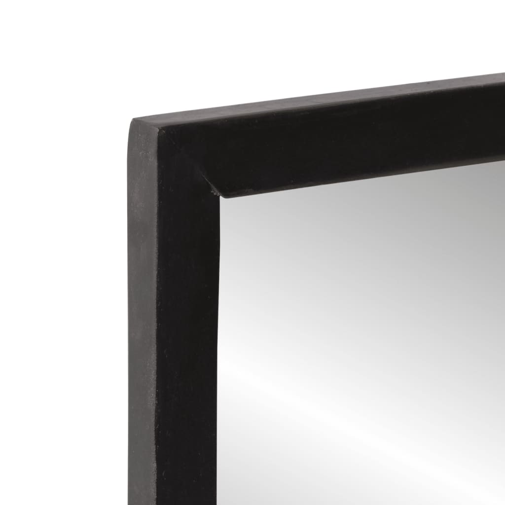Close-up of the black frame corner of the mirror with a reflection in the glass