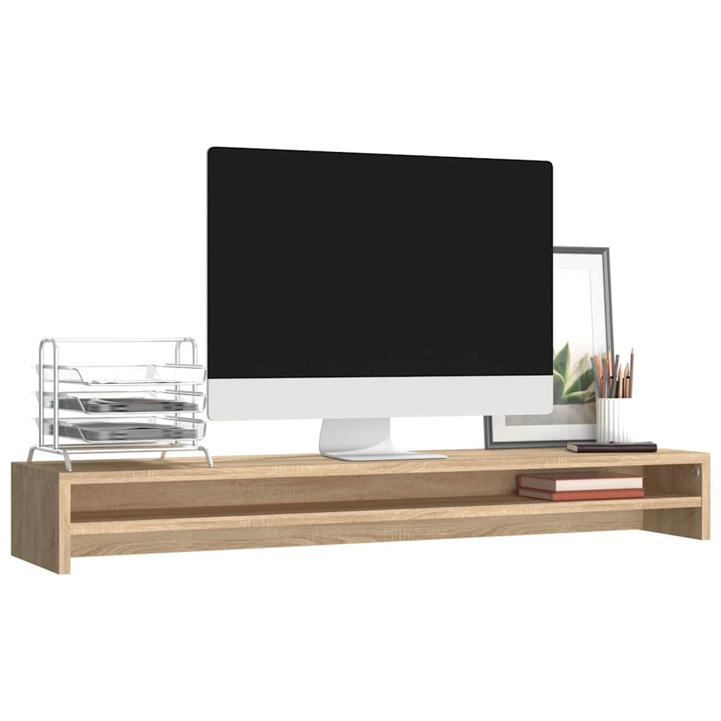 The monitor stand supporting a computer screen and office stationery items