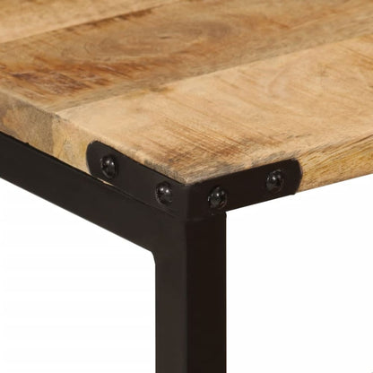 close up of the corner of a wooden table top with black metal frame and rivets