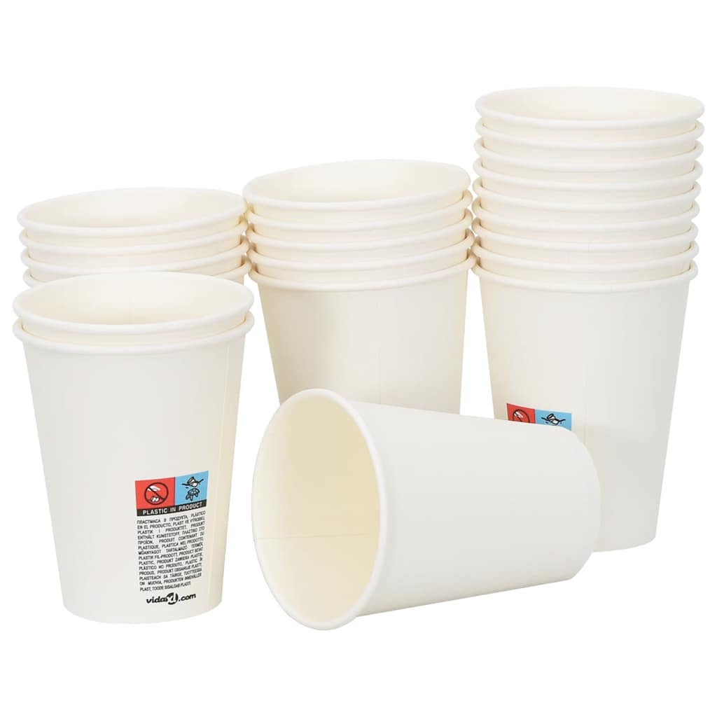 Several white paper coffee cups, some upright and one lying down, showing the product packaging