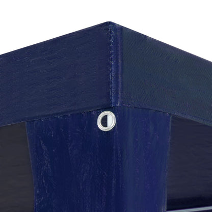 The party tent corner showing the blue fabric and a metal eyelet for securing the cover