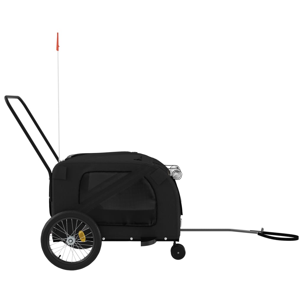 Side view of the black pet bike trailer with a tow bar extended
