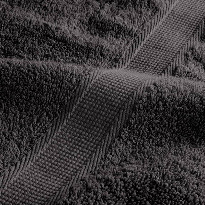 A detailed view of the woven border and plush fabric of an anthracite towel