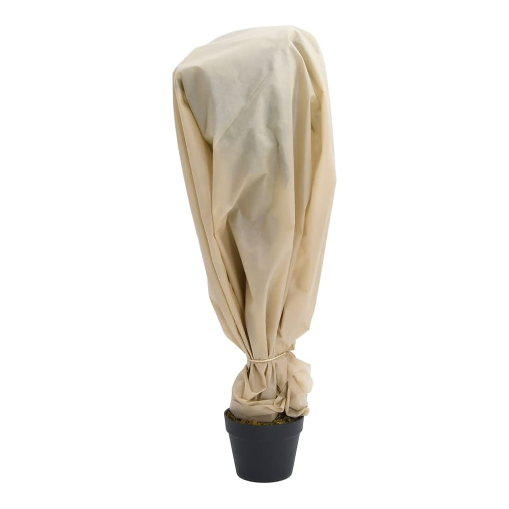 A small potted plant covered with the beige plant fleece for protection