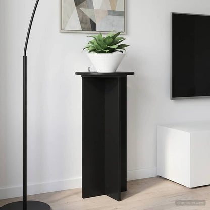 A black plant stand holding a potted plant next to a television