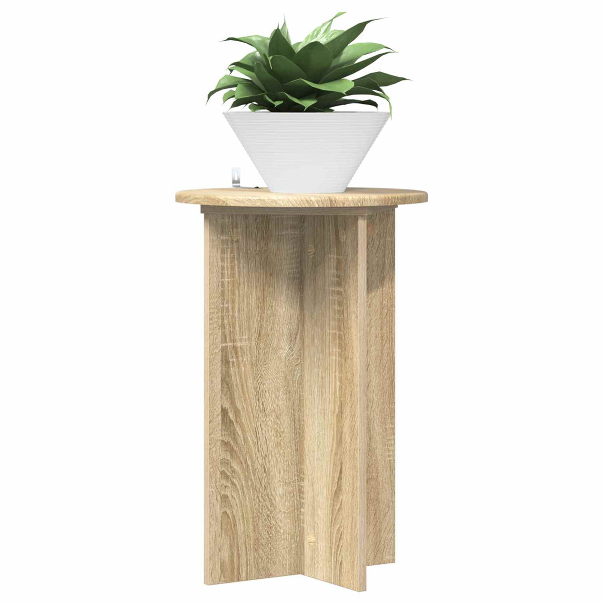 The plant stand with a white pot and green plant placed on its circular top surface