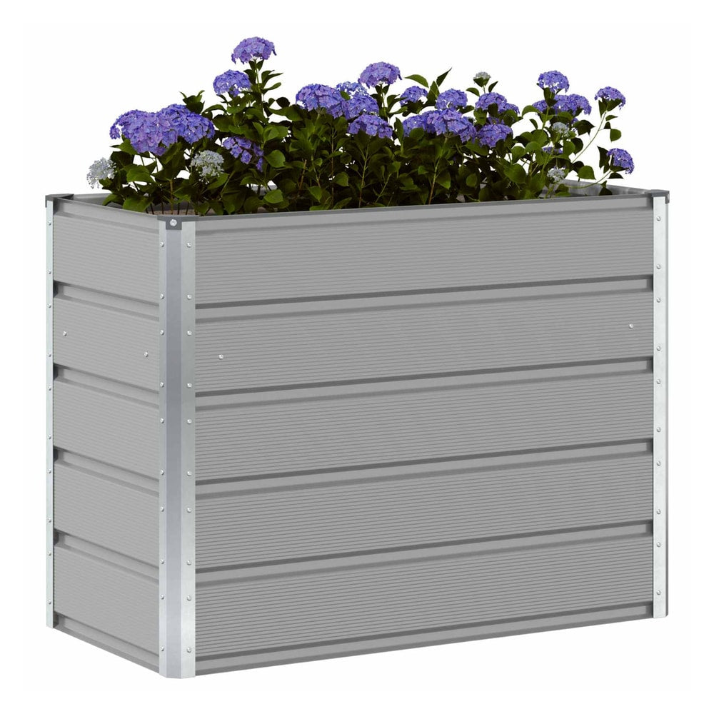The light grey galvanised steel planter filled with purple flowers