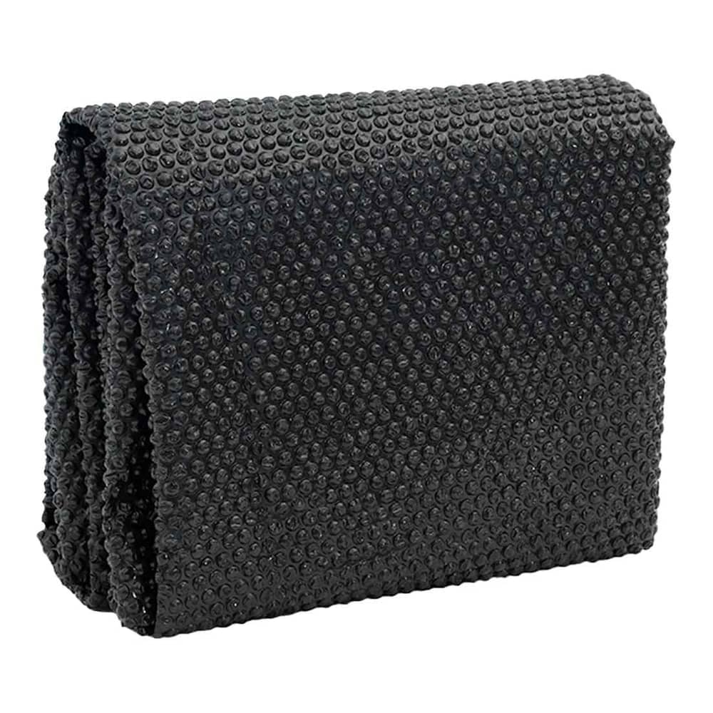Folded black solar pool cover showing its bubble texture