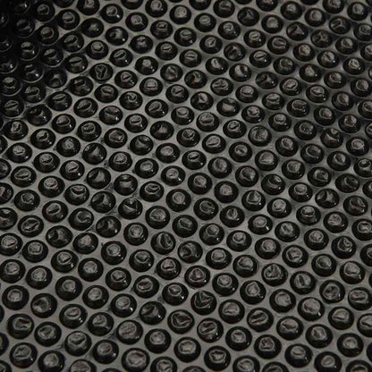 Detailed view of the bubble texture on the black pool cover