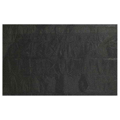 The black pool cover laid flat showing its full surface