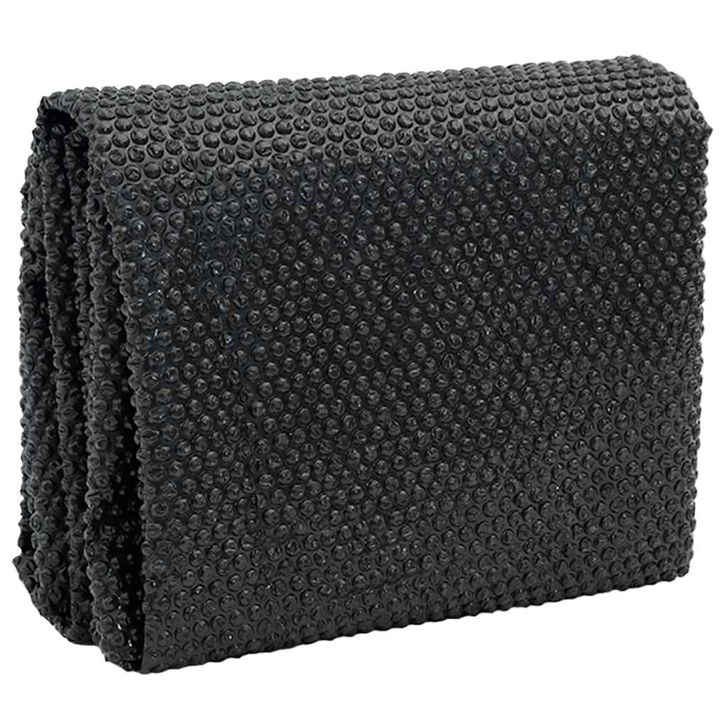 The pool cover folded showing its bubble texture