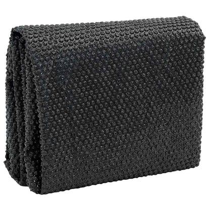 The pool cover folded showing its bubble texture