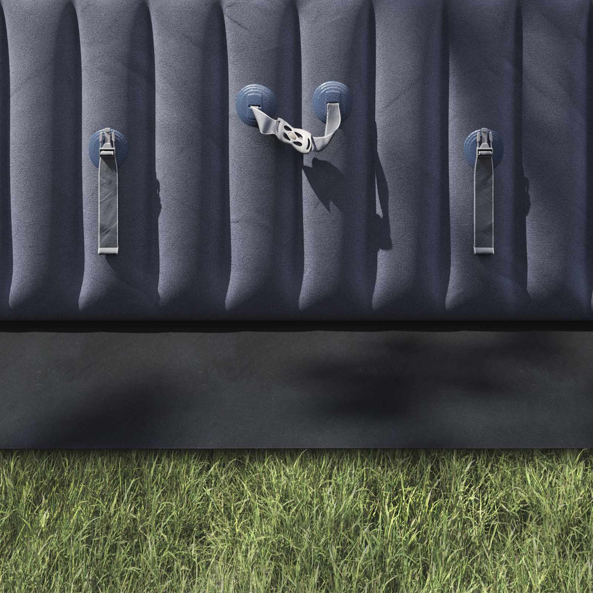 The pool ground sheet is black and protects the grass underneath an inflatable pool