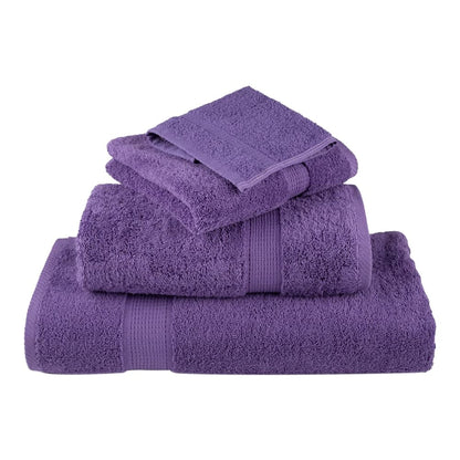 A stack of three purple towels with a smaller towel on top