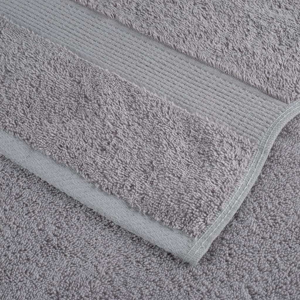 the grey cotton towel showing the stitched hem and ribbed border detail