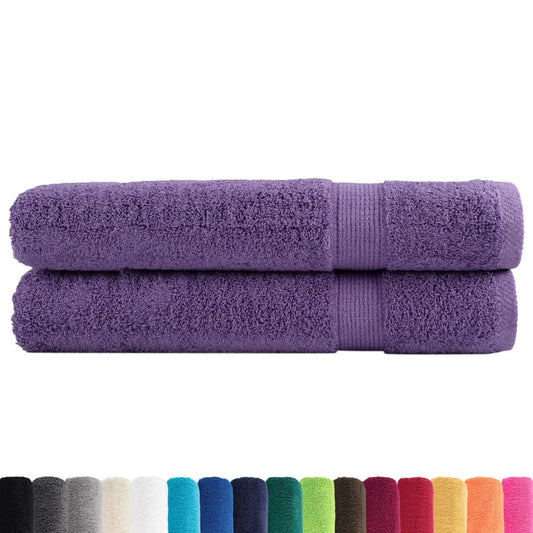 Two purple towels with a row of different coloured towels below