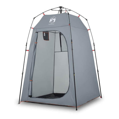 The grey privacy tent with the door open showing the interior space