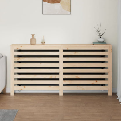the radiator cover in a domestic setting, placed against a wall with decorative items on top