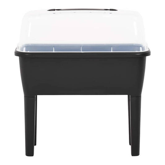 The raised garden planter shown from the front with its transparent cover