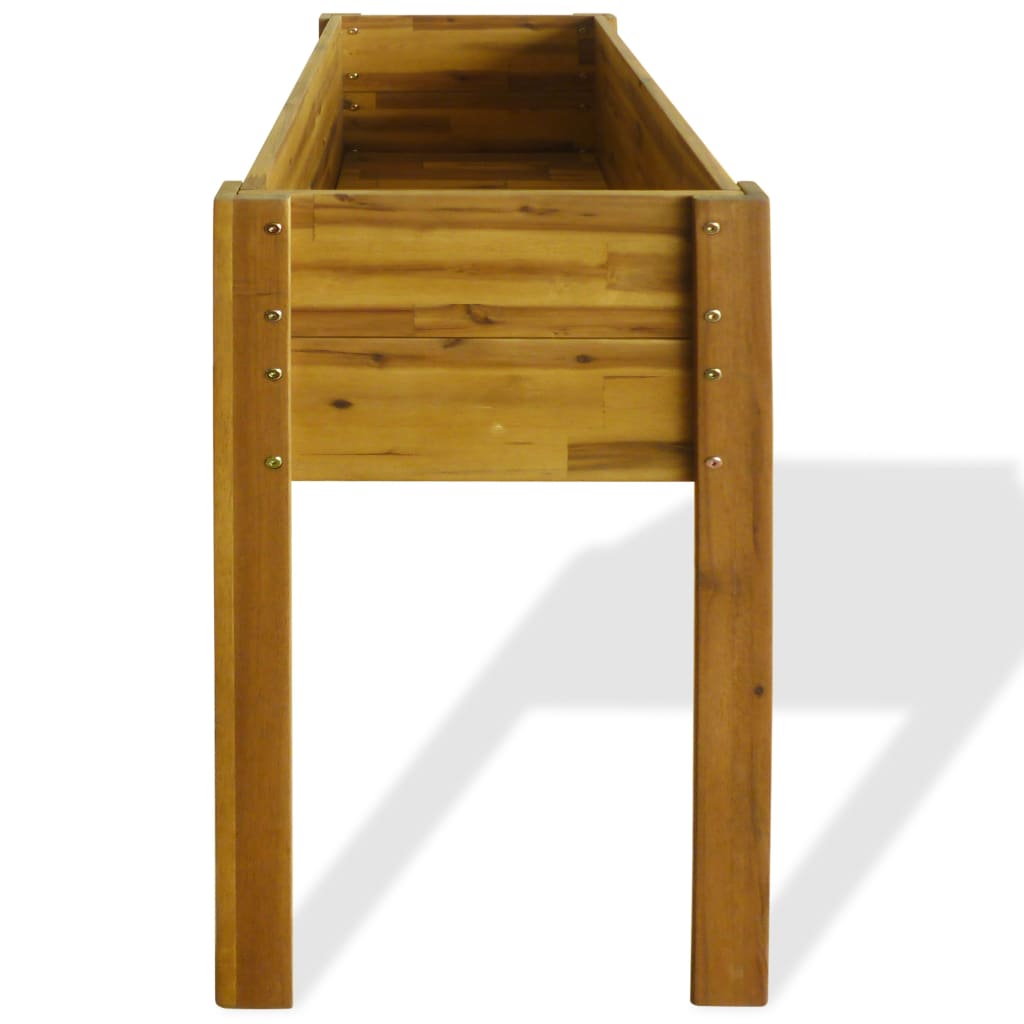 Side view of the wooden raised garden bed, showing its height and construction