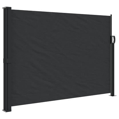 The black retractable side awning fully extended, showing its fabric surface