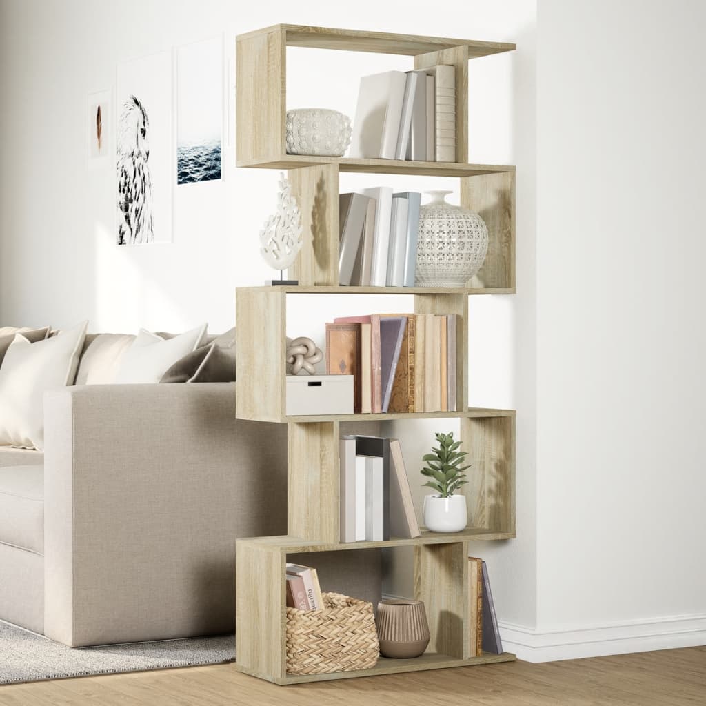 The standing shelf styled with various books and ornaments in a bright room
