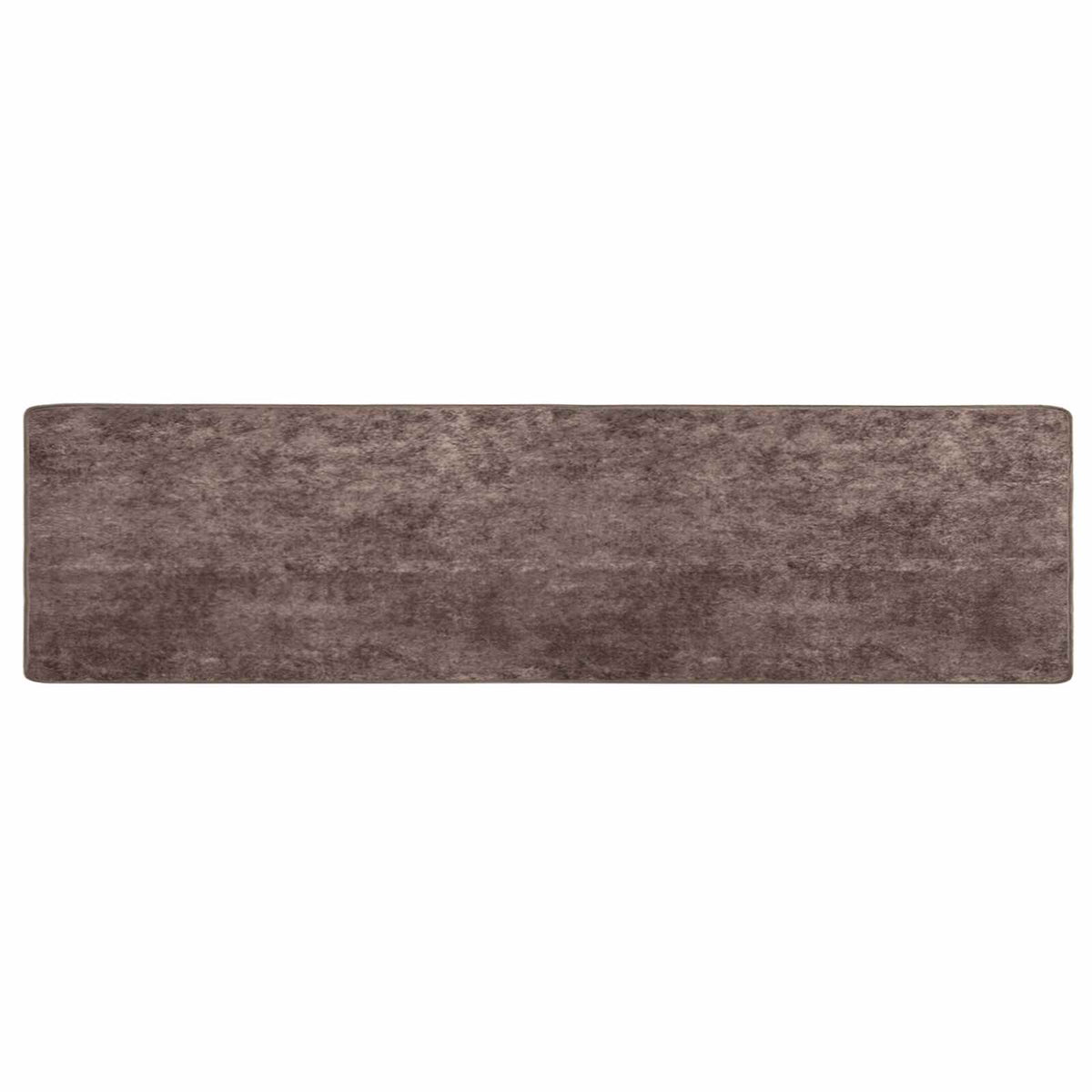 Grey MARSA rug runner laid flat on a wooden floor