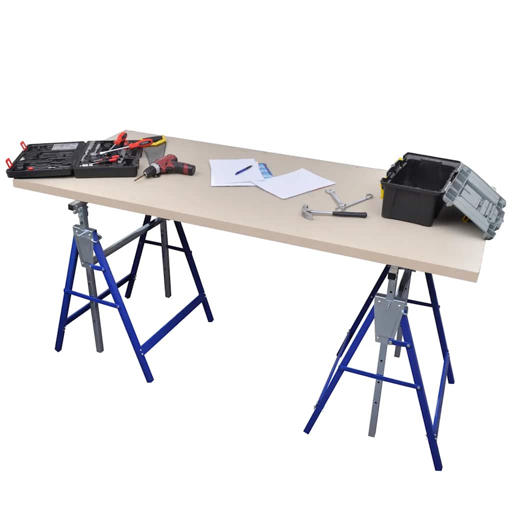 A workbench created using two scaffolding trestles and a wooden board, with tools