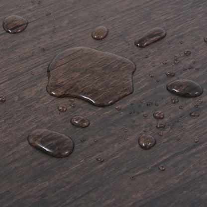 Water droplets on the dark brown self-adhesive flooring planks demonstrating water resistance