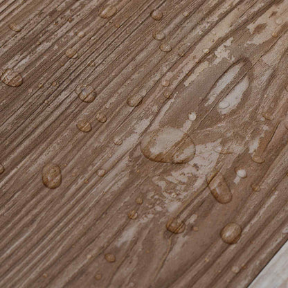 Water droplets on the surface of the self-adhesive PVC flooring planks showing water resistance