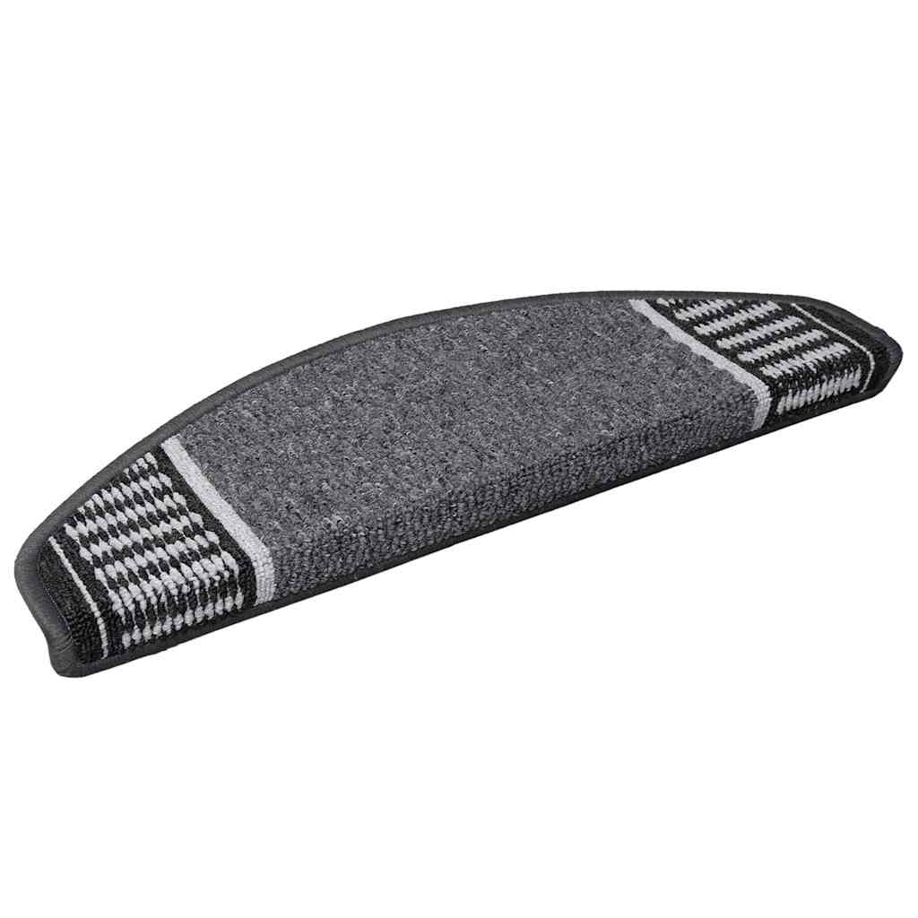Close-up of a single grey self-adhesive stair tread with a textured surface