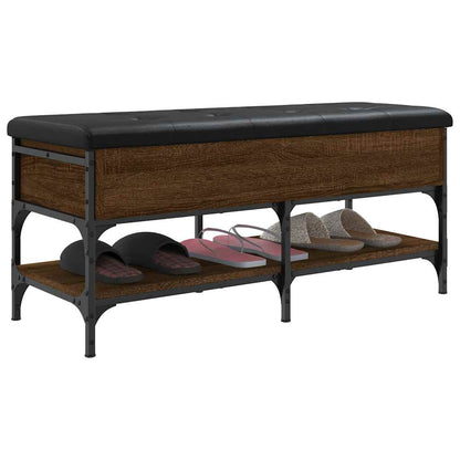 A storage bench with a padded seat and two open shelves for shoes