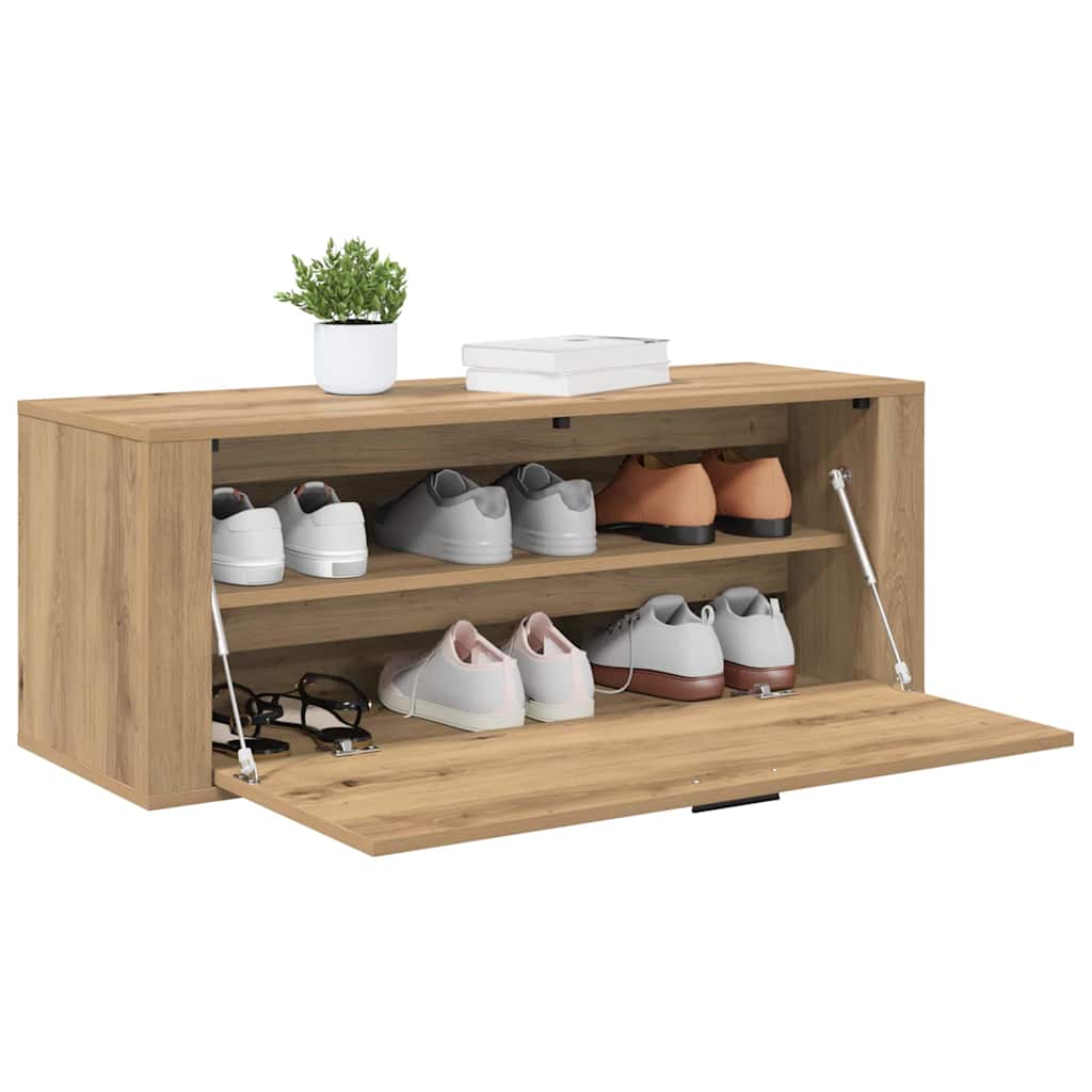 the shoe cabinet with the front door open revealing two internal shelves filled with shoes