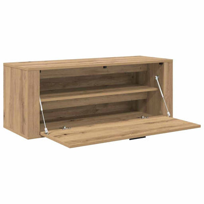 the shoe cabinet with the front panel lowered to show the empty interior shelving