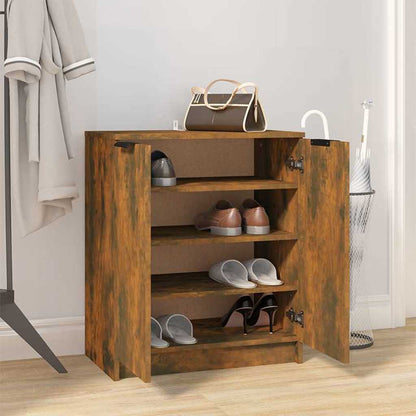 The shoe cabinet in a room with doors open and various shoes stored on the shelves
