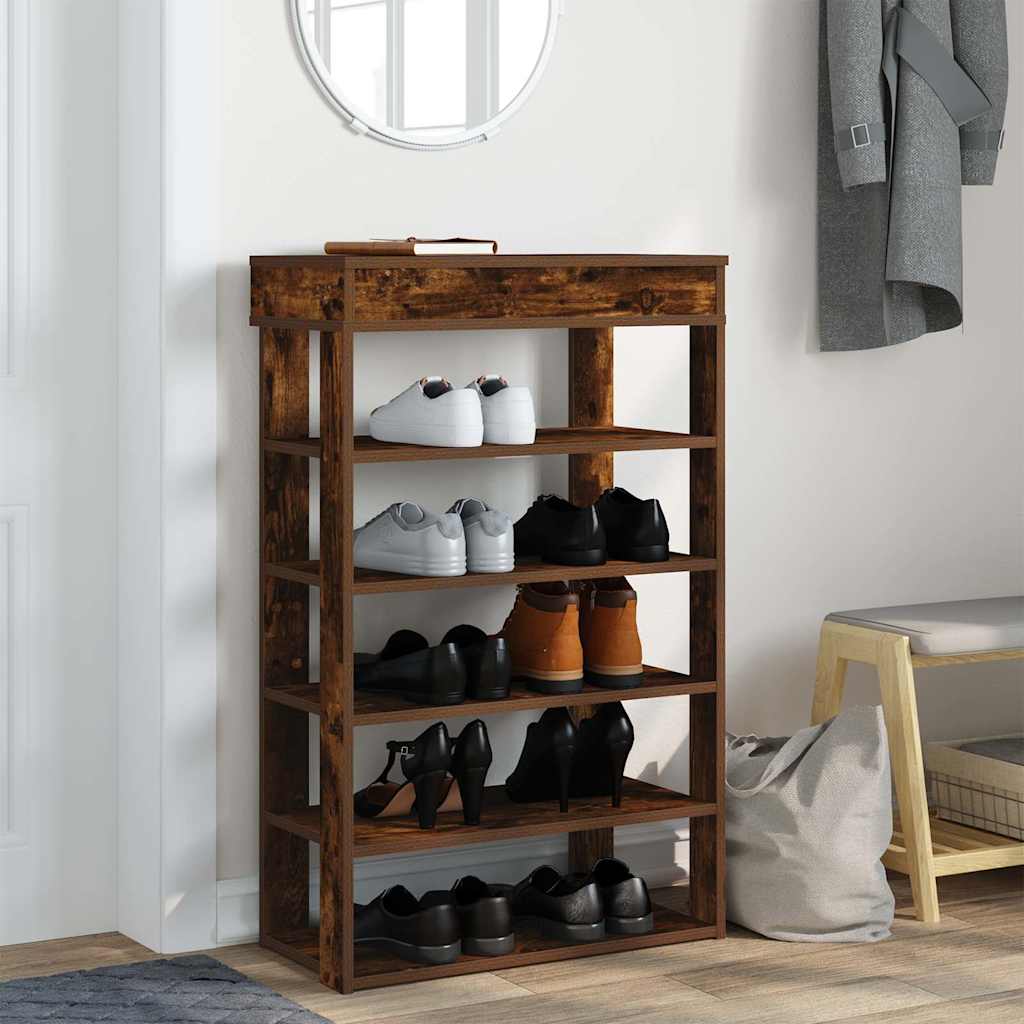 The shoe rack in a hallway, with coats hanging nearby and a bag on a bench