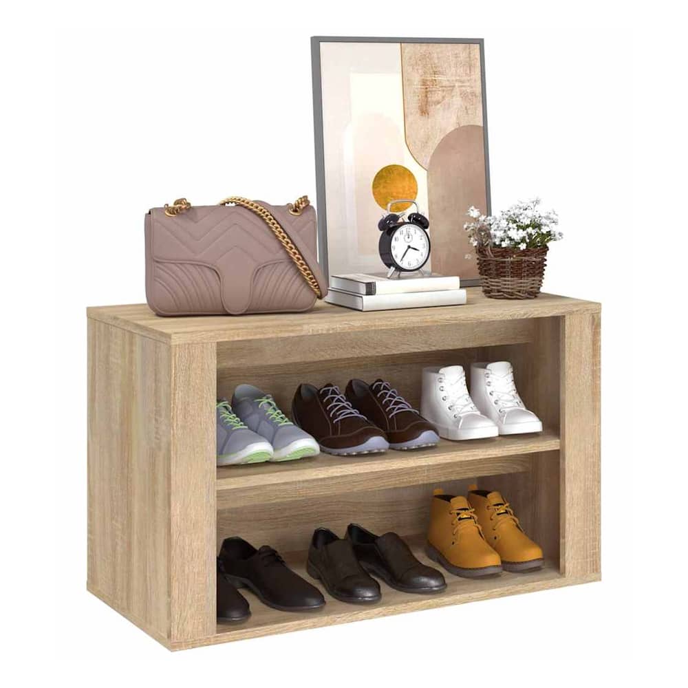 A close-up of the shoe rack with shoes and decorative items on top