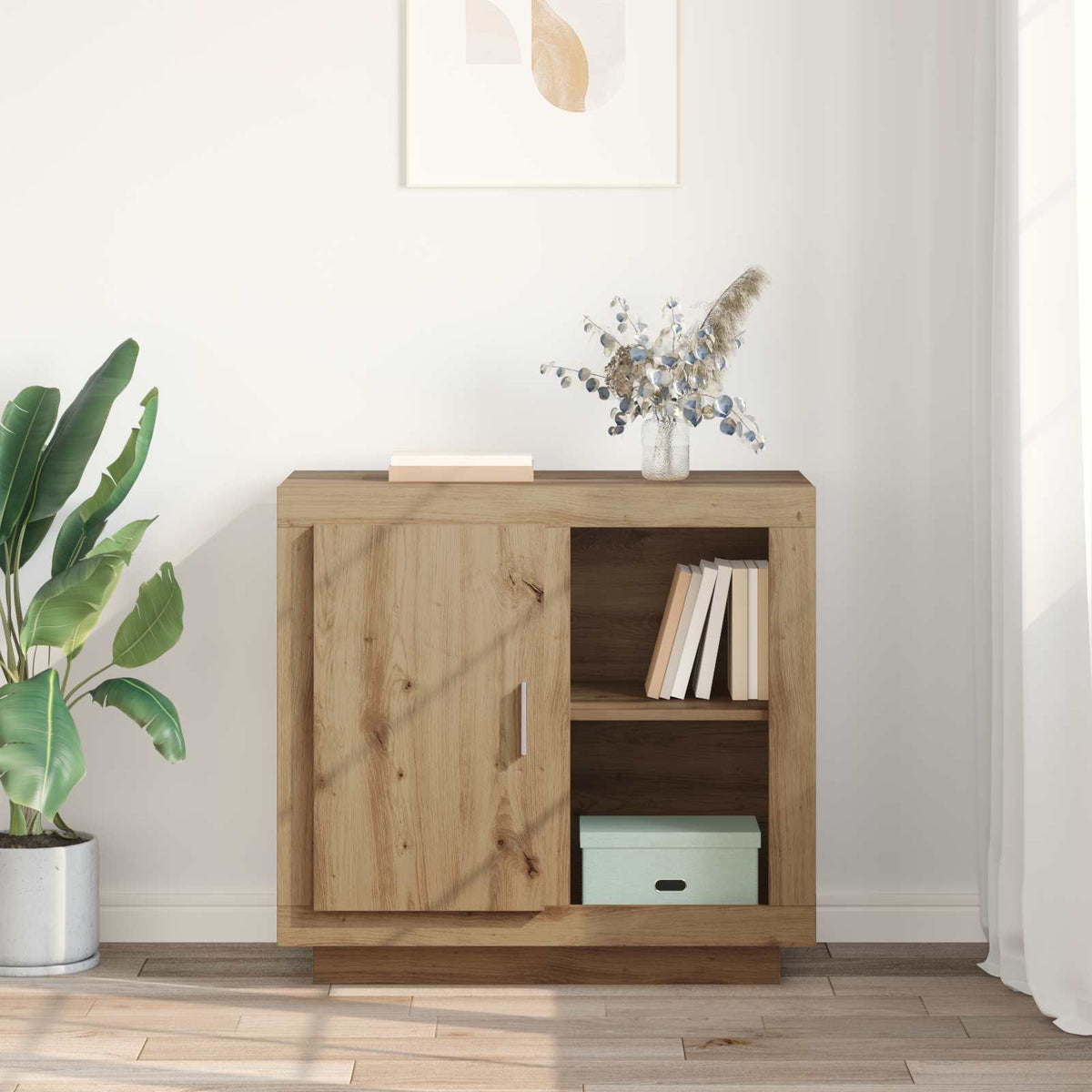 The buffet and sideboard is styled in a room with plants and books