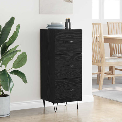 The black oak sideboard with three drawers and thin metal legs, shown in a room setting