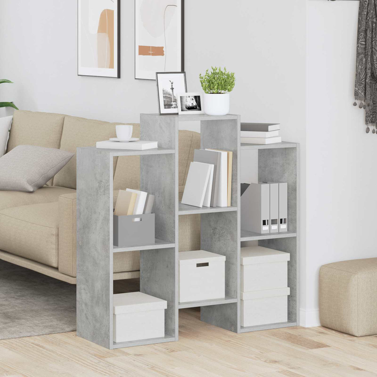 Concrete grey shelving unit in a living room setting with books and boxes