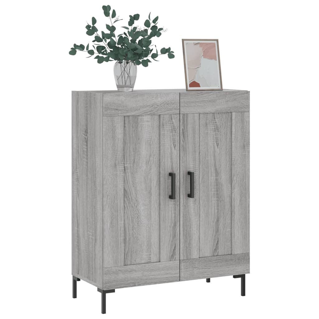 The sideboard decorated with a plant in a vase and a framed picture on top