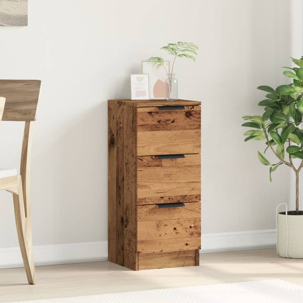 The sideboard in a room setting next to a chair and plant