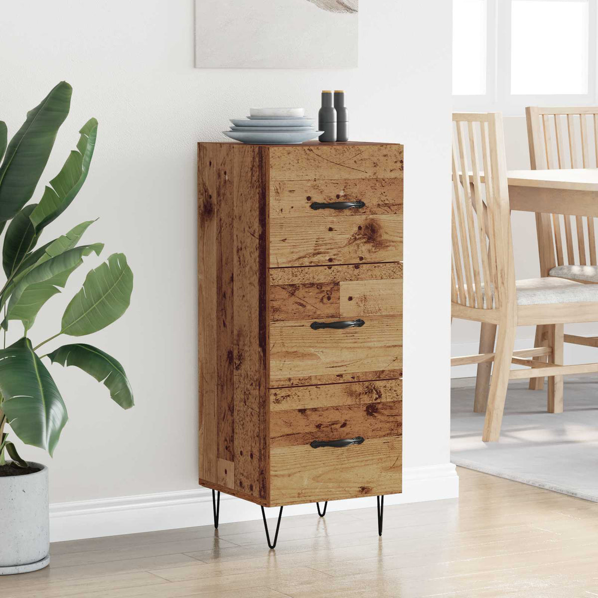 The rustic sideboard placed in a dining area with a stack of plates on the top surface