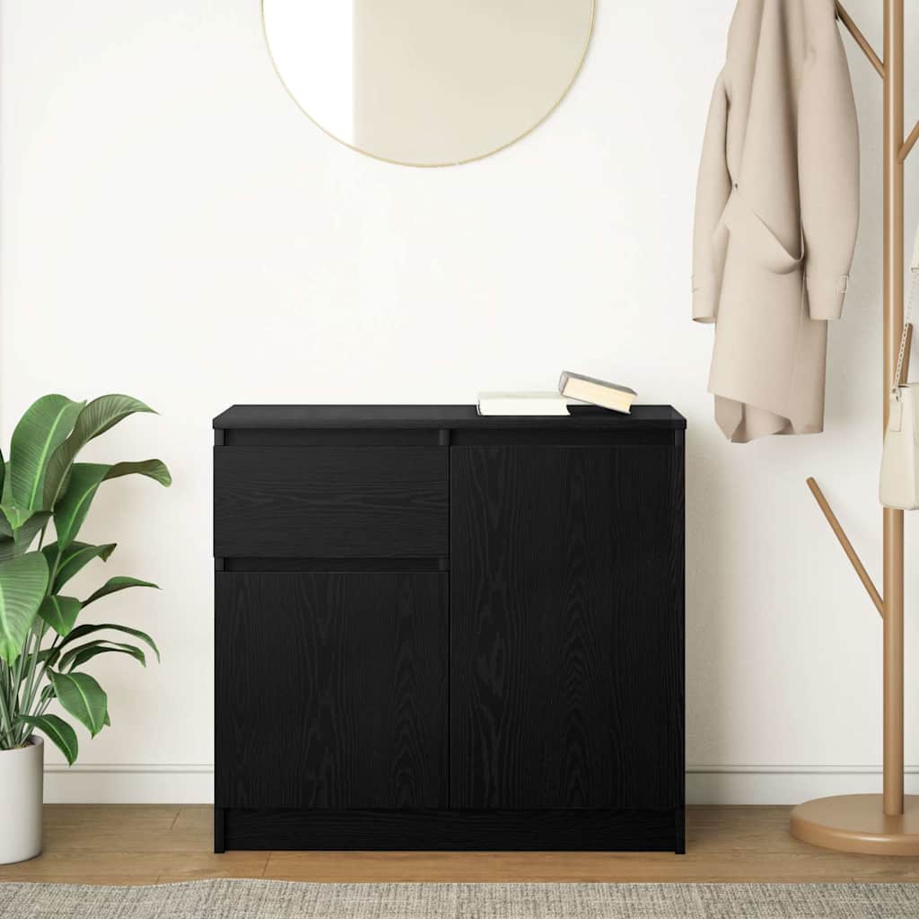 The black sideboard positioned in a room with a plant and coat rack nearby