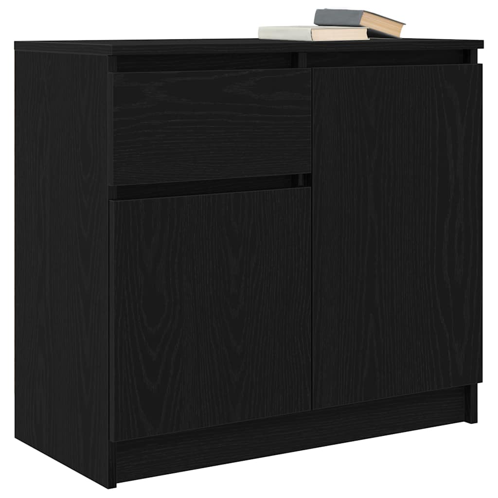 The black sideboard with books on top viewed from a slightly elevated perspective
