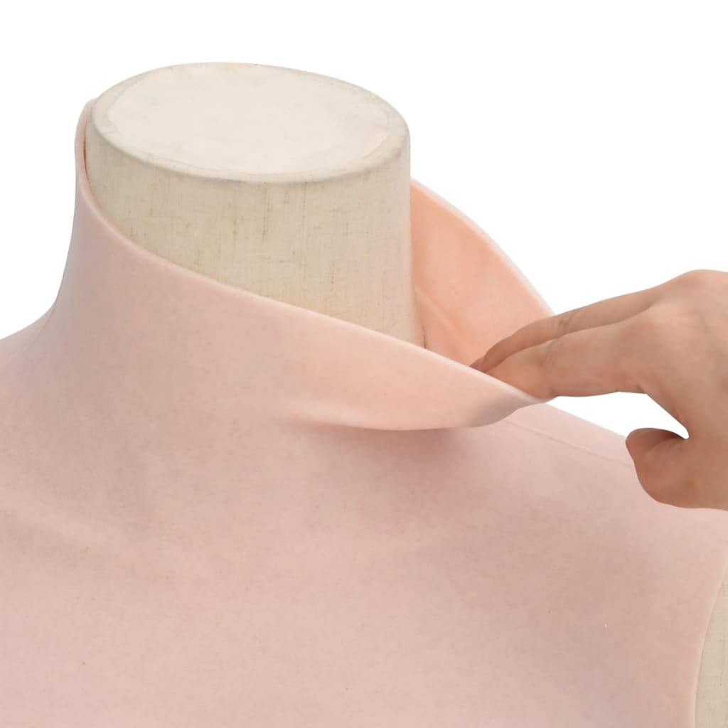 a hand stretching the neck collar of the silicone breastplate