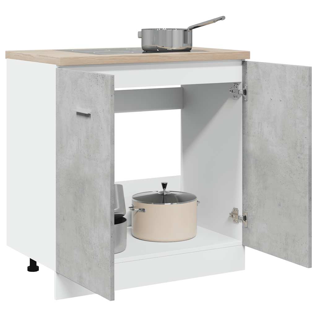 The sink base cabinet with its doors open showing storage space and pots