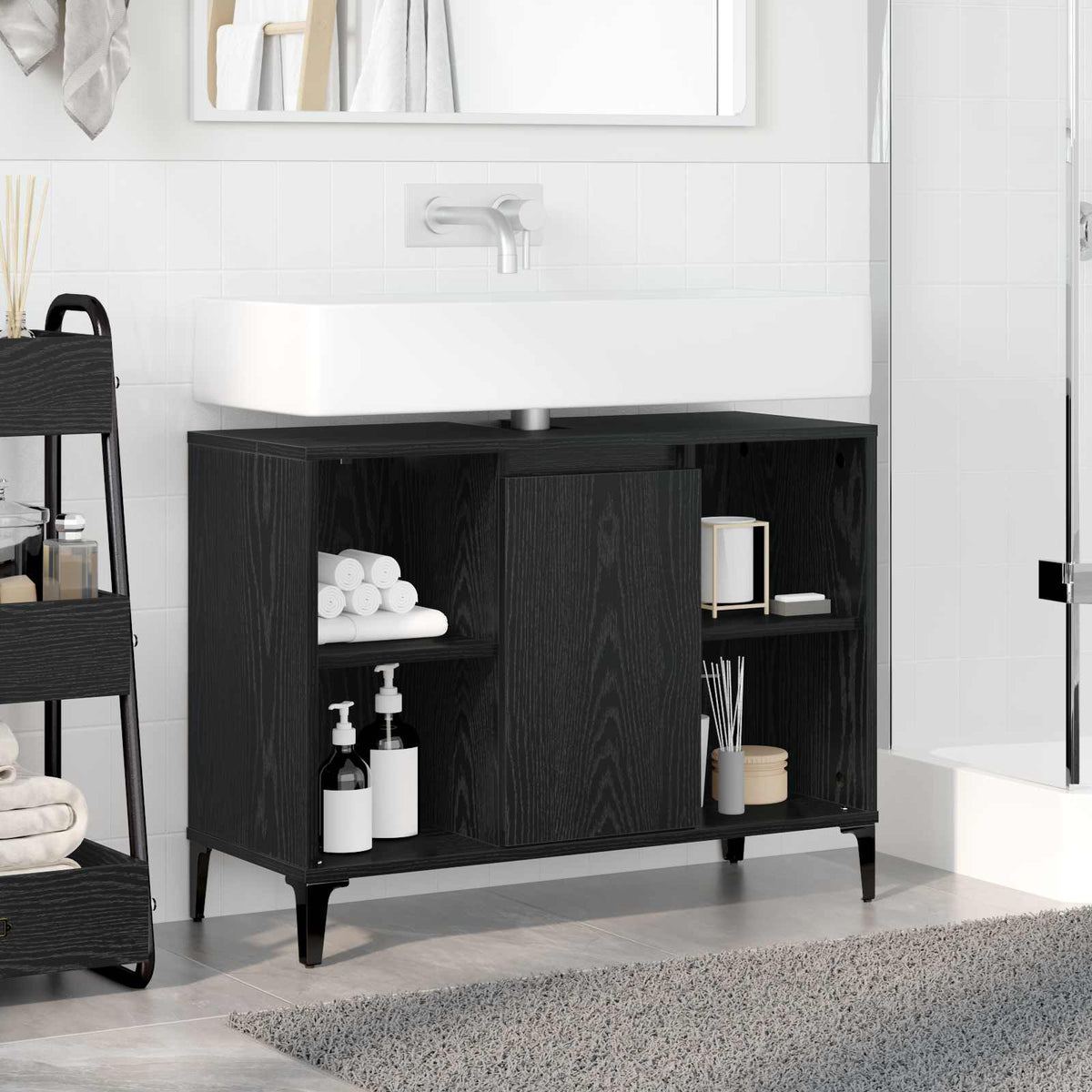 The black oak sink cabinet installed in a bathroom with a white basin and tap above