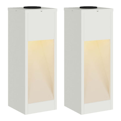 Two white pathway lights with illuminated fronts, showing the warm white light emitted