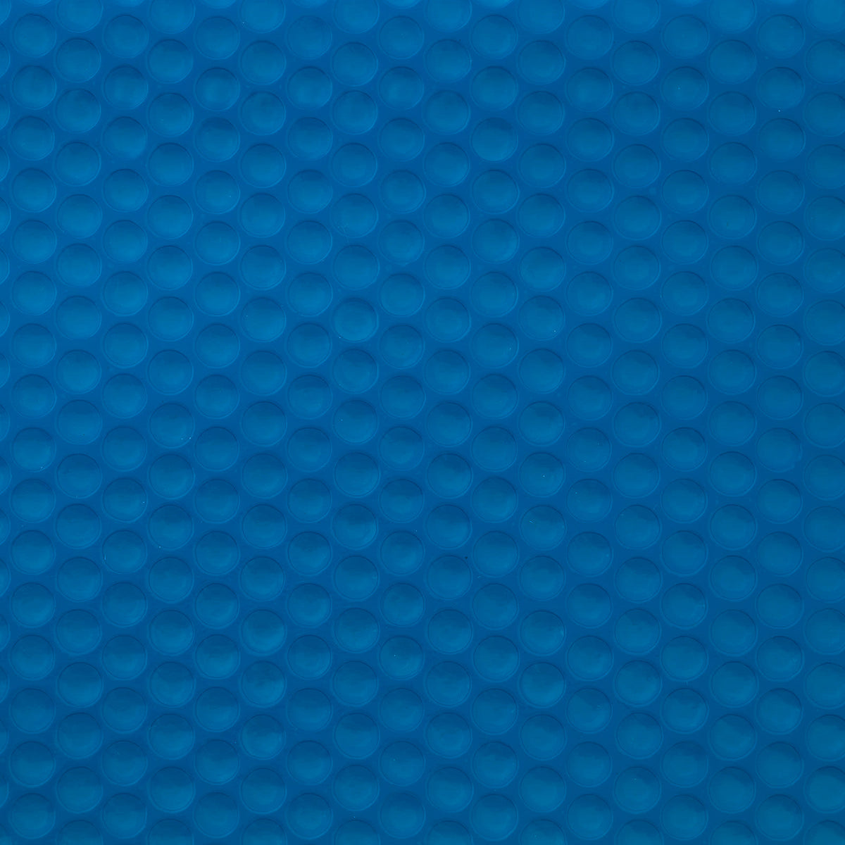 the pool cover surface showing the pattern of small circular bubbles